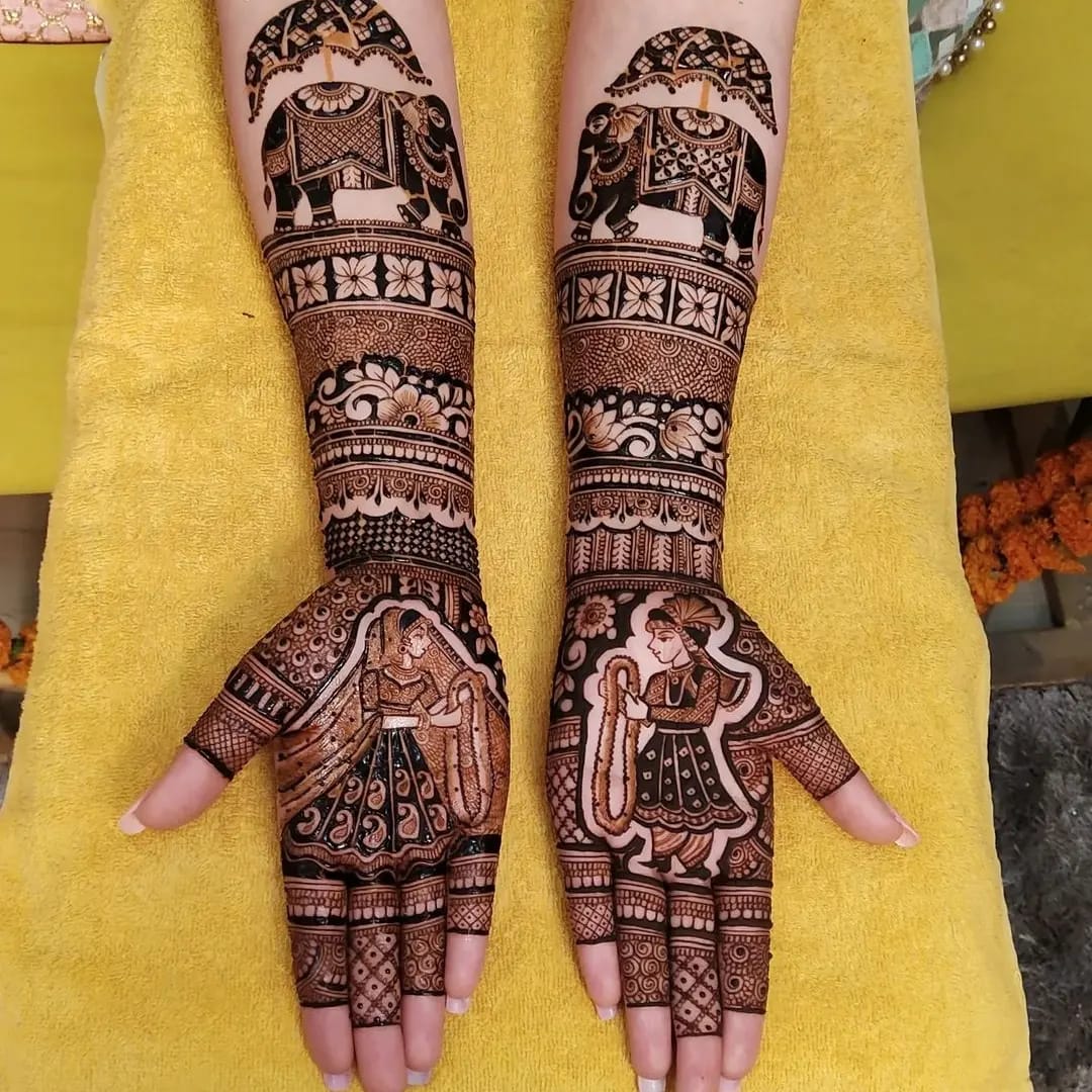 Classic bridal mehndi with elephants and dulha-dulhan palms