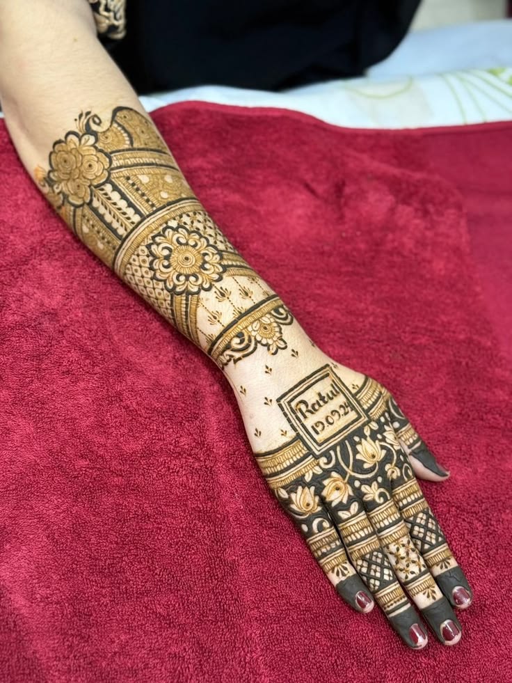 Half-hand floral mehndi with personalised name detail