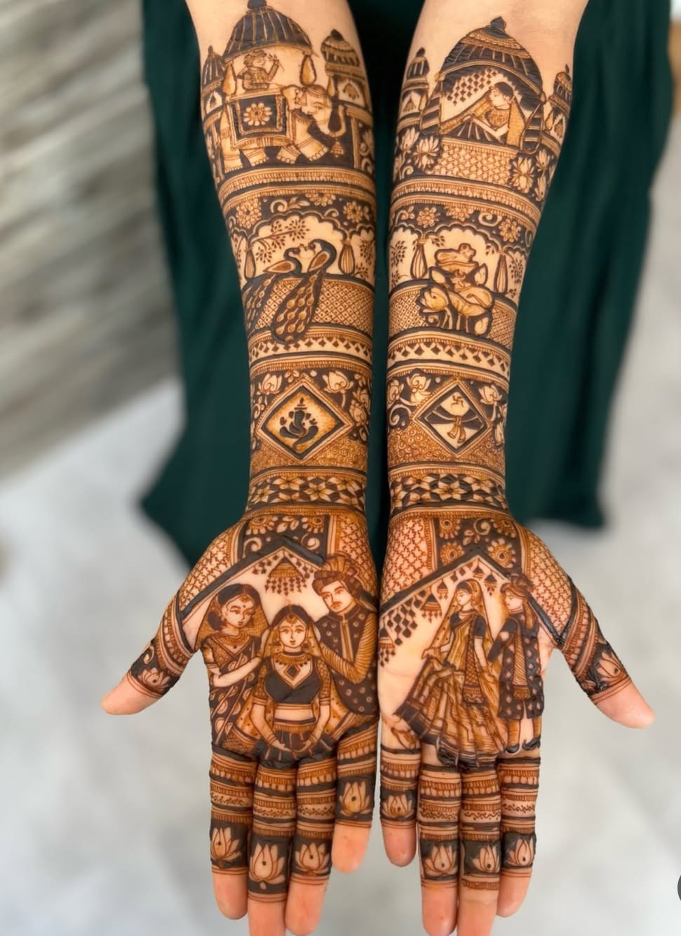 Full-arm bridal mehndi with dulha-dulhan and elephant panels
