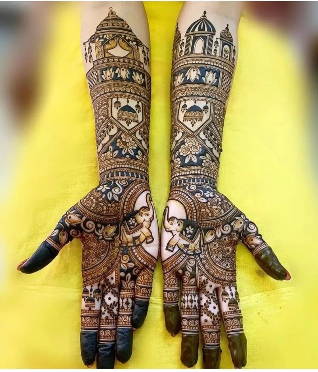 Intricate full-arm Rajasthani henna design with elephants