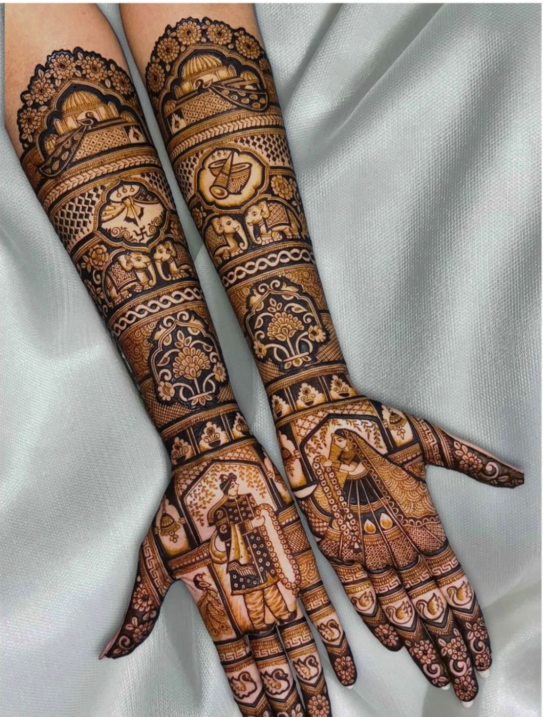 Elegant bridal henna with temple domes and floral bands