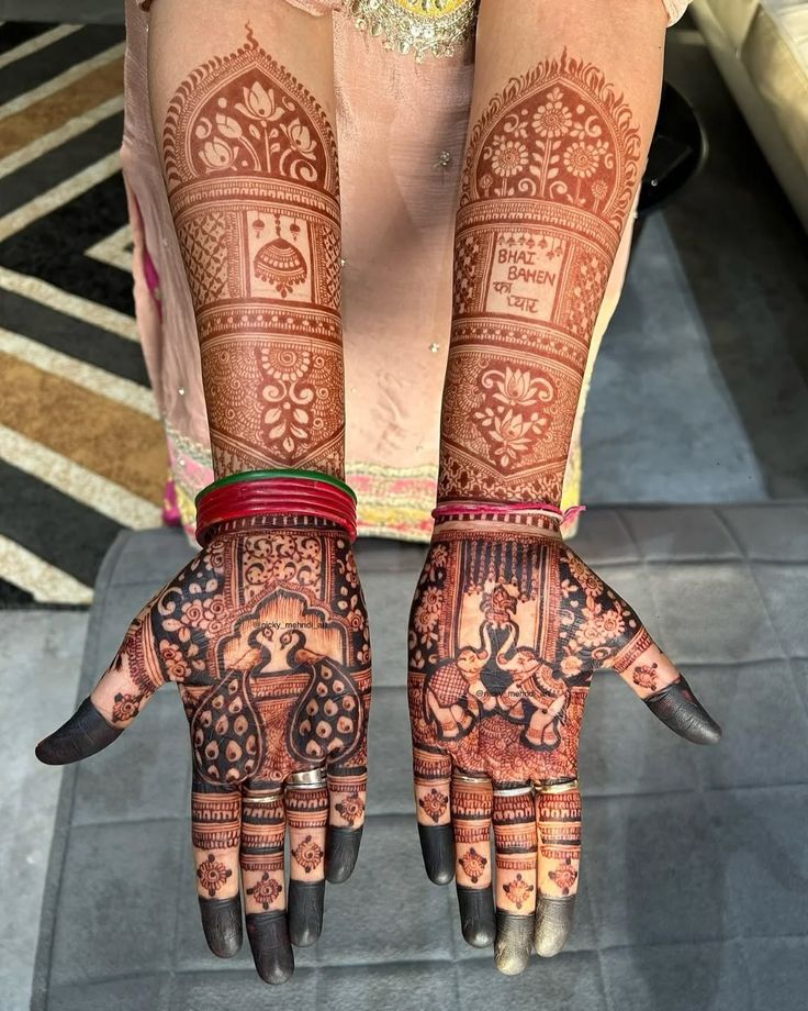 Bridal mehndi with peacock and elephant palm motifs