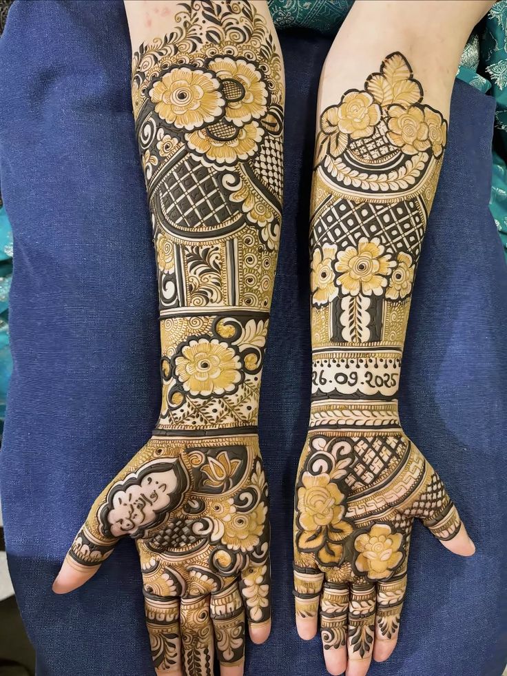 Bold floral full-arm mehndi with shaded rose motifs