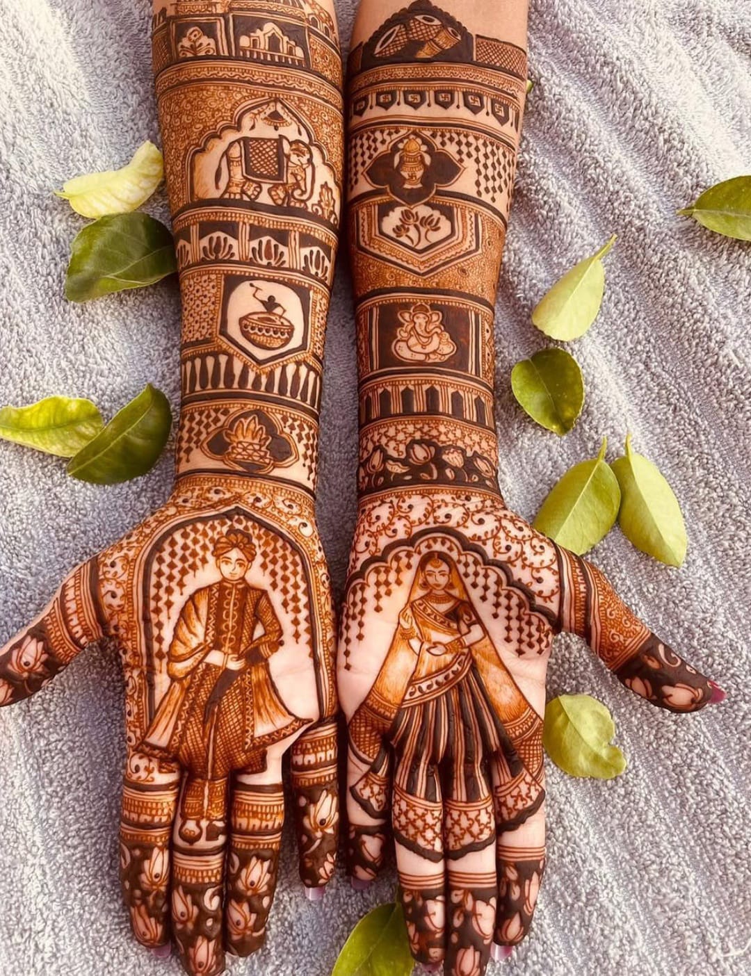 Rich bridal henna with Ganesha, elephants and portrait palms