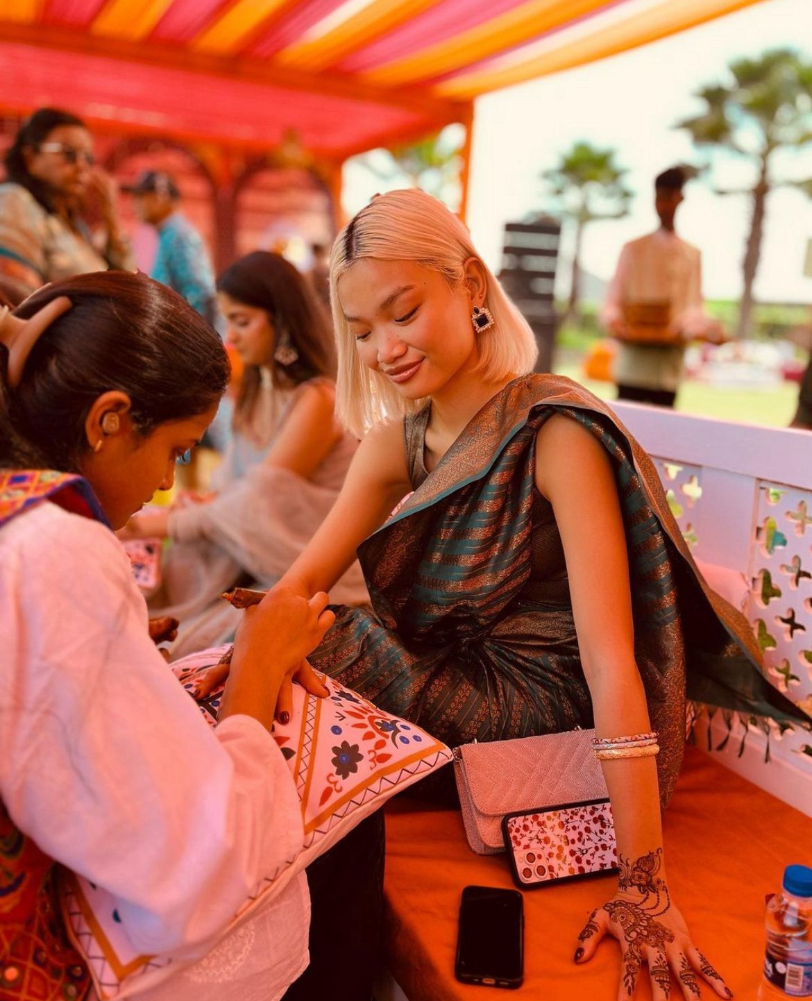 Artist applying delicate henna at a destination wedding in Jaipur